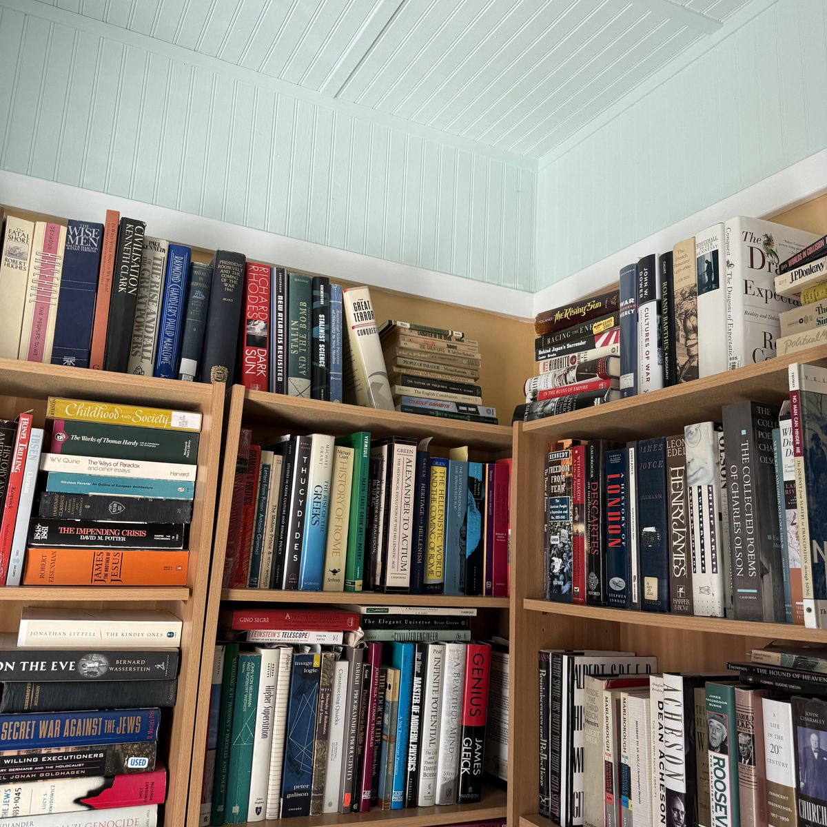 A home library with floor-to-ceiling shelves — the kind of collection that stalls closings and complicates estate timelines.